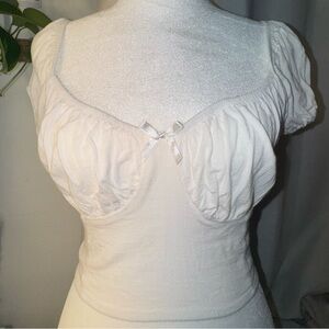 Cute white cropped top with a bow in the middle